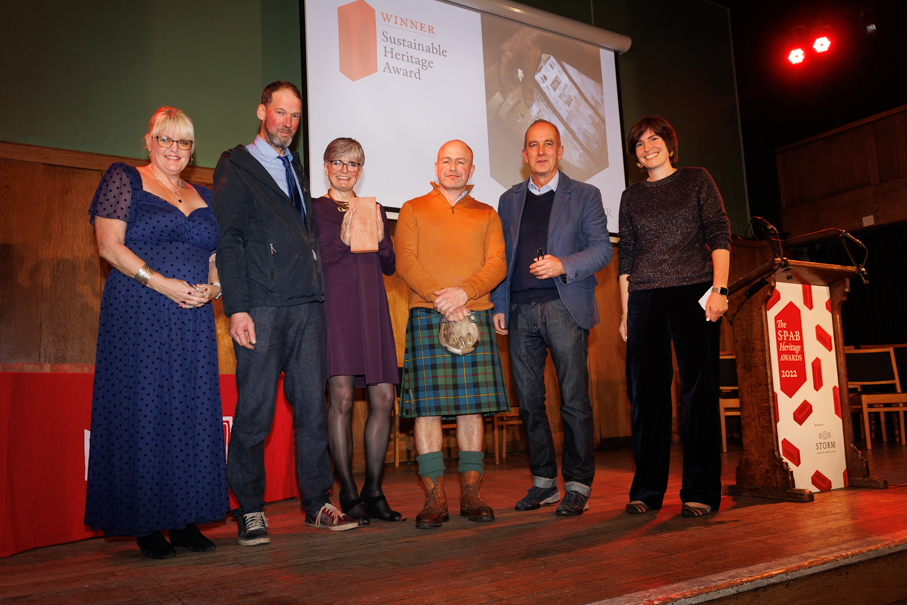 The team receiving the Sustainable Heritage Award with Kevin McCloud