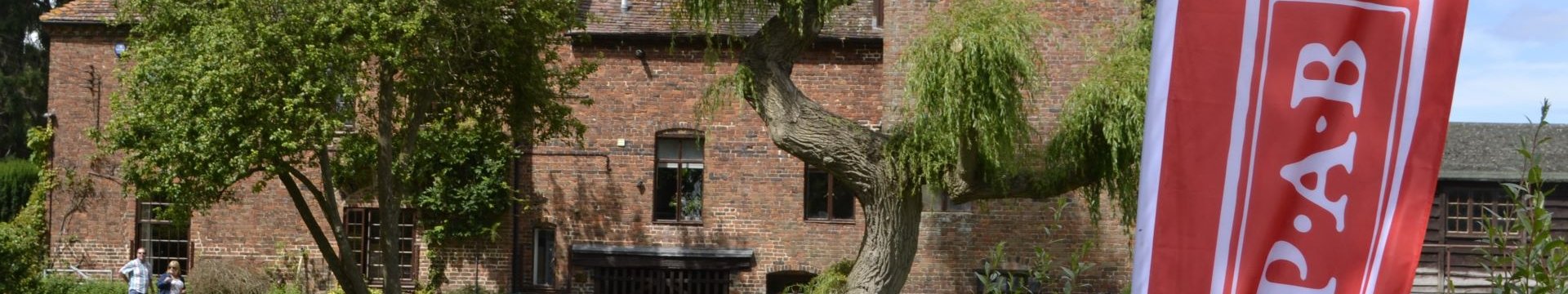 Fladbury Mill with a SPAB Banner